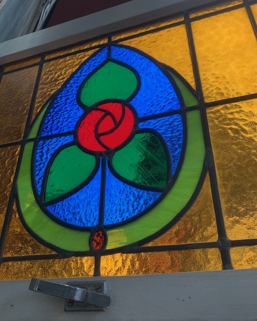Detail of full colour leadlight window in timber frame, hopper ...